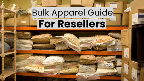 An illustration of bulk apparel inventory for a wholesale clothing firm in 2025, featuring folded t-shirts, hoodies, and jeans placed on shelves against a warehouse backdrop.